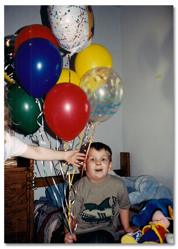 Photo Brock Walquist with balloons.