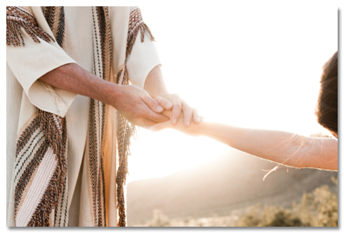 Photo of Jesus holding a woman's hand.